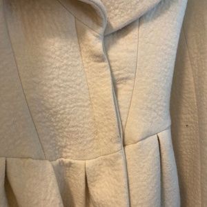 Cream colored wool blend Alexander McQueen peplum Coat